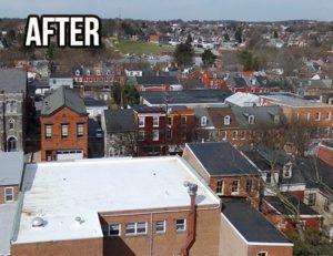 Aerial view of a building with a white flat roof that has been recoated with a Duro-Tuff 50mm PVC membrane.