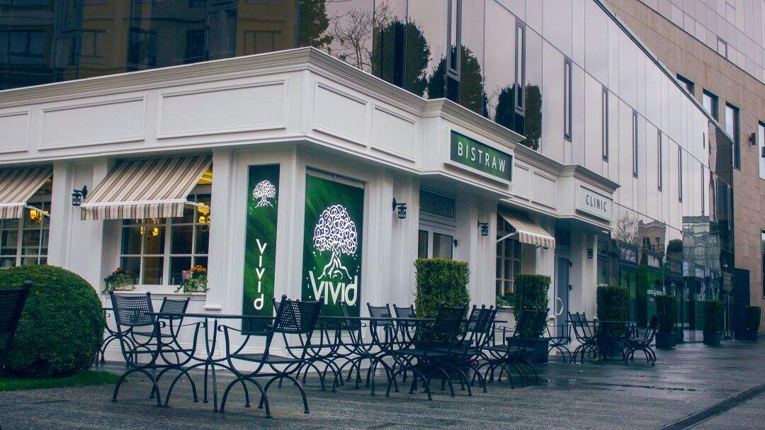 exterior of a restaurant with a commercial flat roof