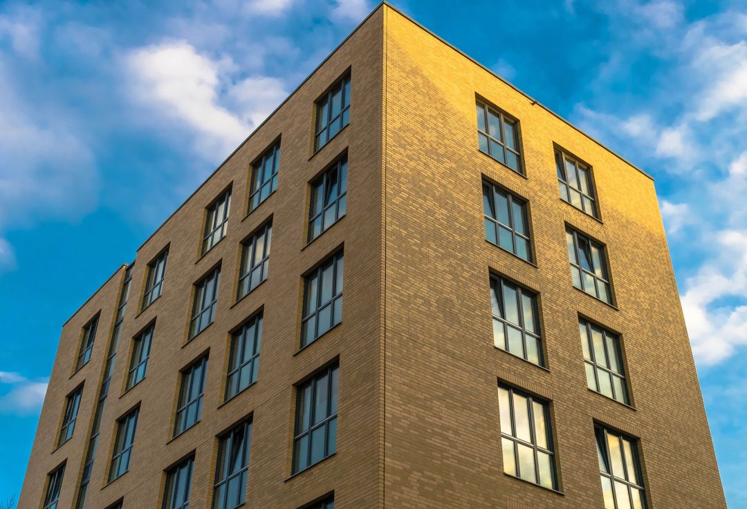 low angle of a brick commercial building with a flat roof