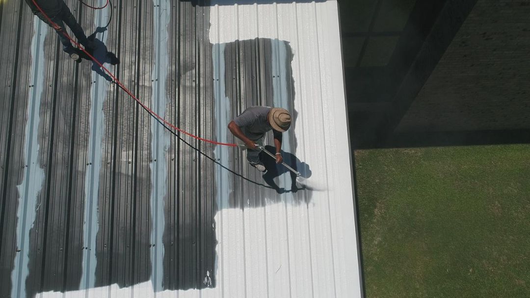 commercial roofing contractor restores commercial roof using a coating