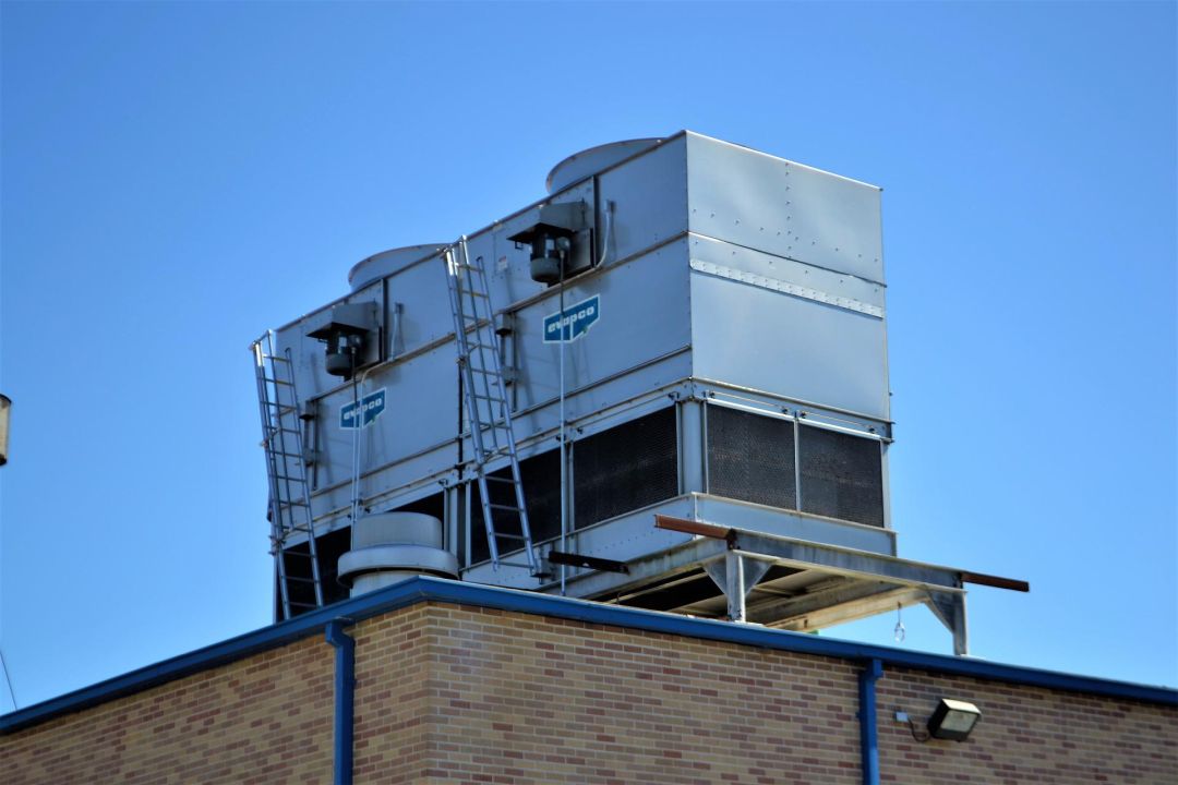 a commercial flat roof with an HVAC unit