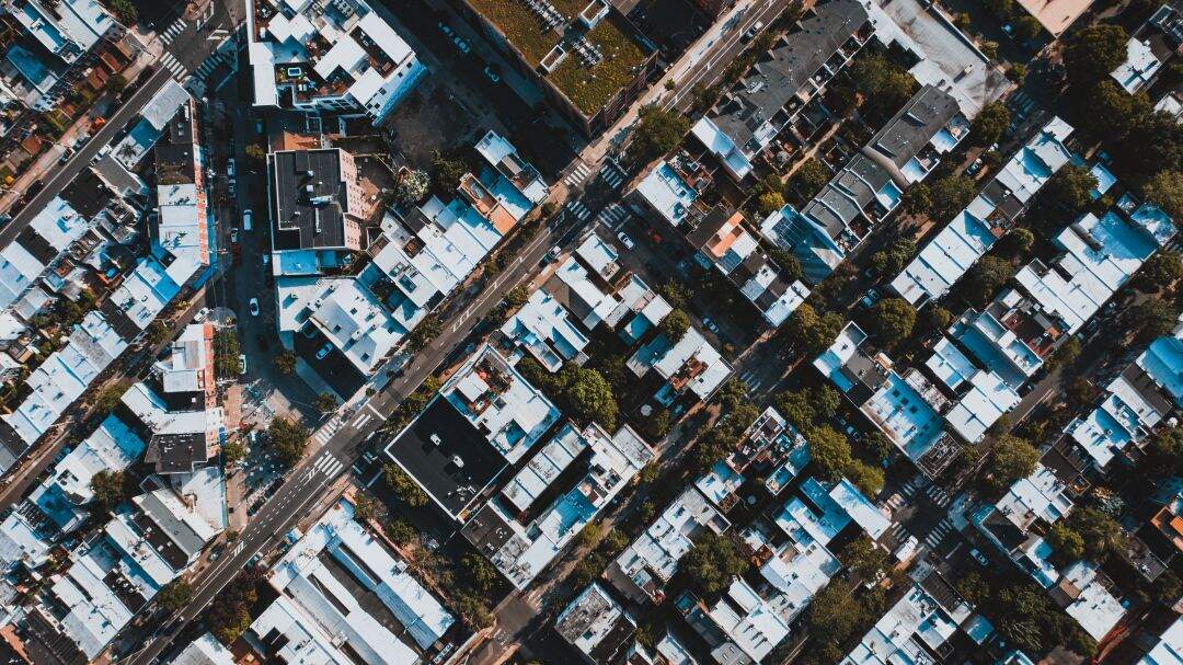 aerial view of many larger commercial buildings with flat roofs