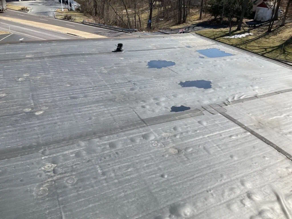 a poorly executed EPDM roofing installation that an expert contractor could have avoided