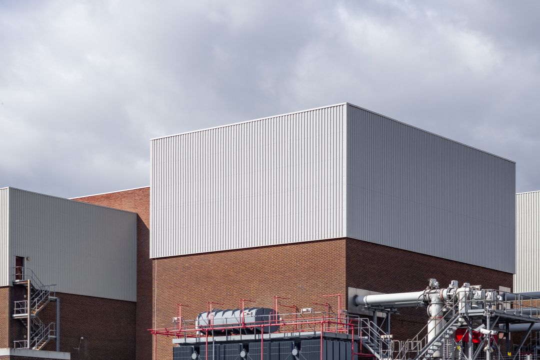 Exterior of an industrial building with a commercial roof.