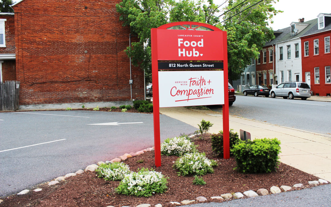 a sign for Lancaster County Food Hub, where Moser completed a TPO roof repair