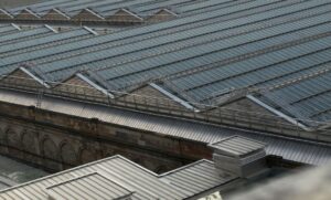 a large metal roof that may be in need of restoration or replacement