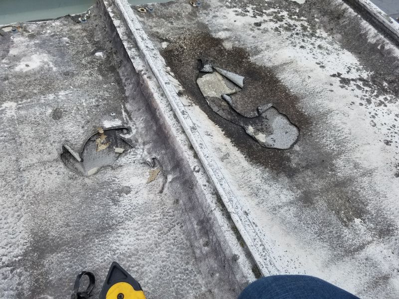 a commercial roof coating that failed due to poor adhesion
