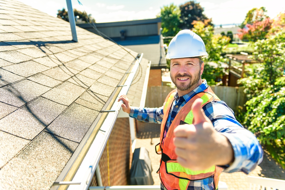 Technician inspecting a roof.