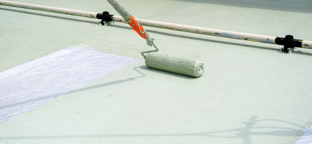 White commercial flat roof gleaming under the sunlight.