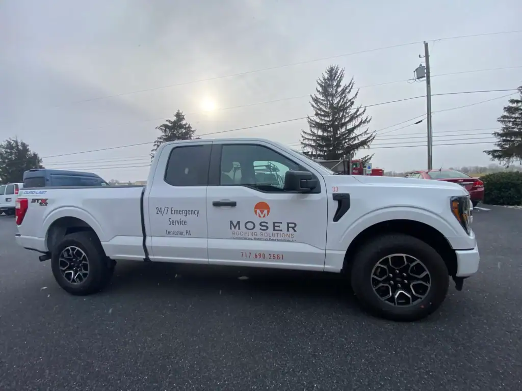 White truck with Moser on the side