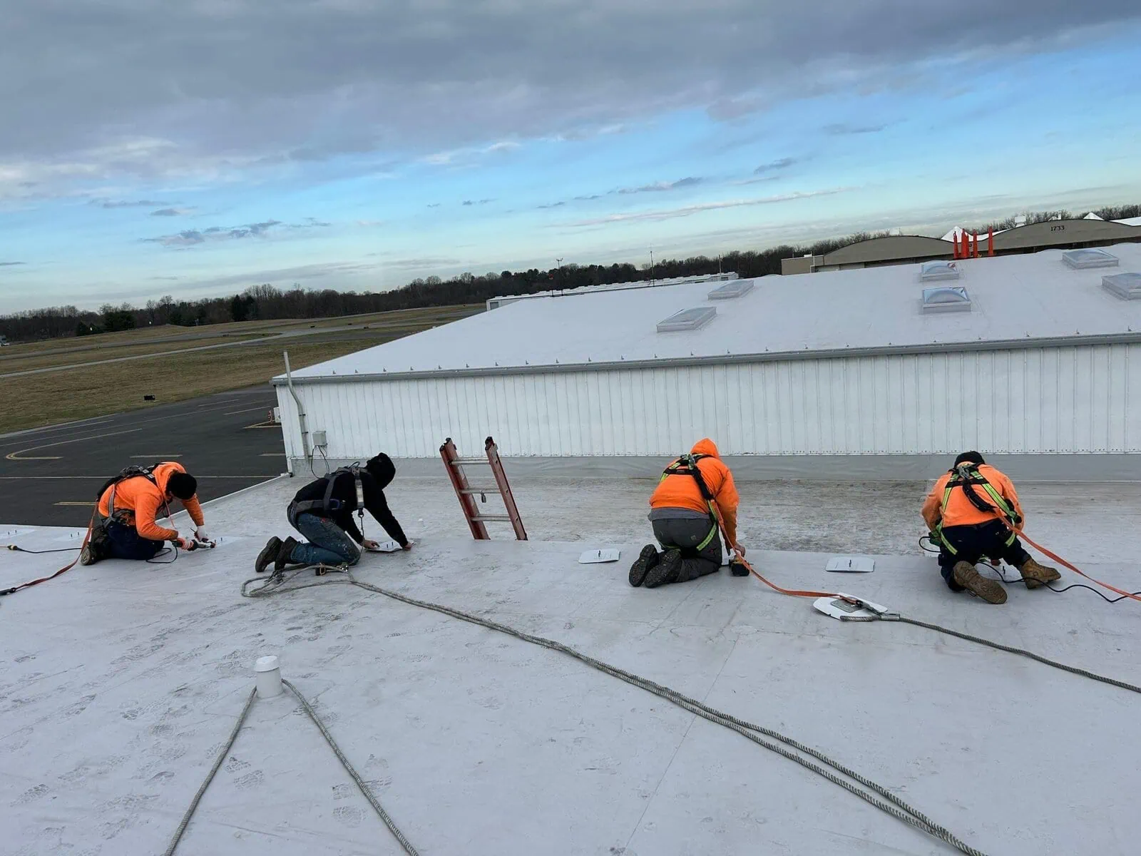 a group of men on a roof