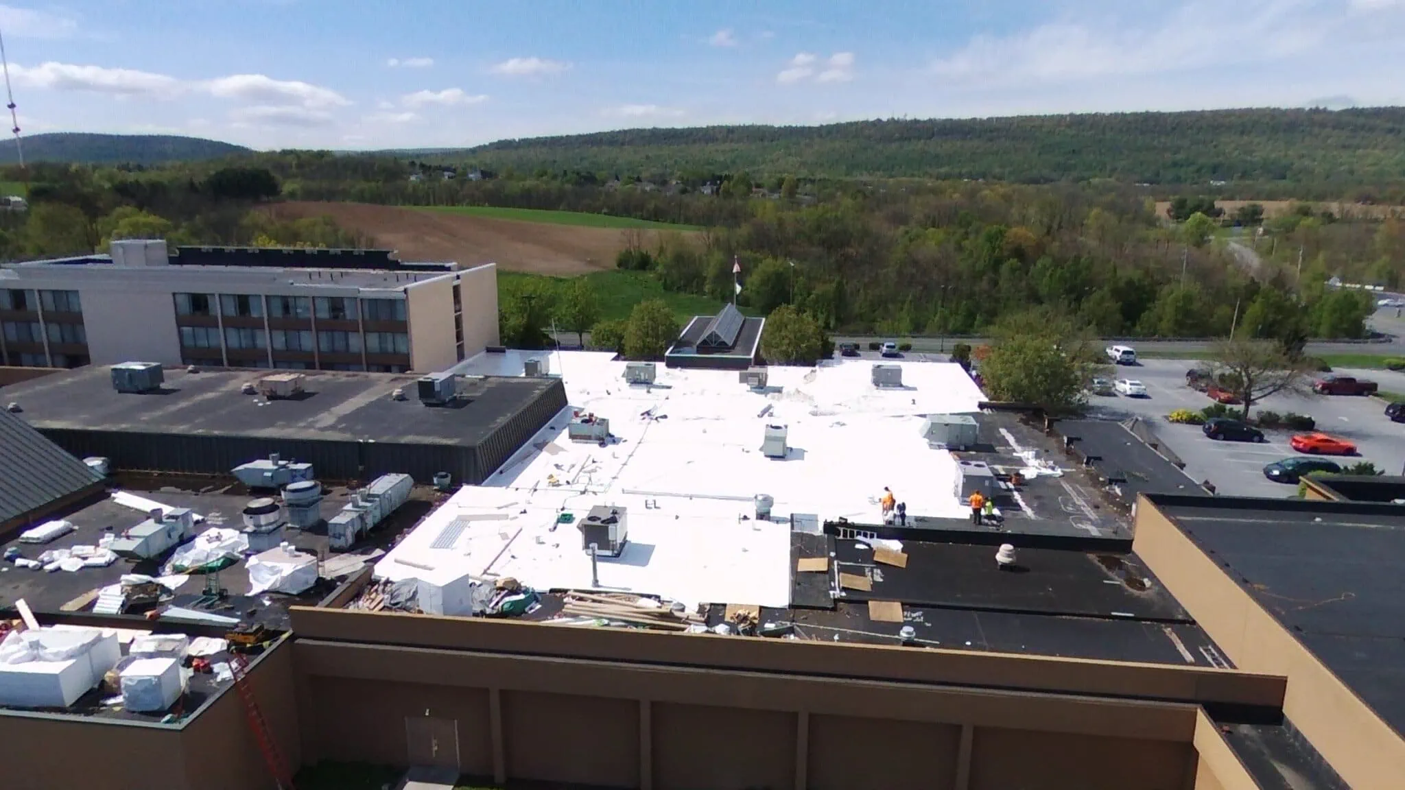 a roof of a building with a few people on it