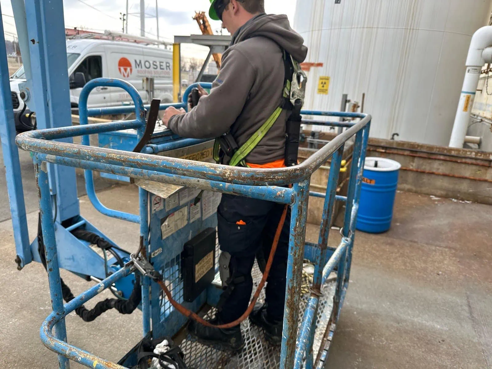 a man in a blue lift