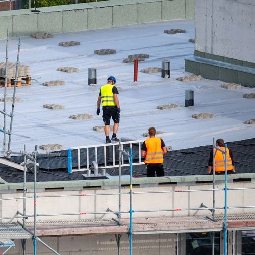 a group of men on a roof