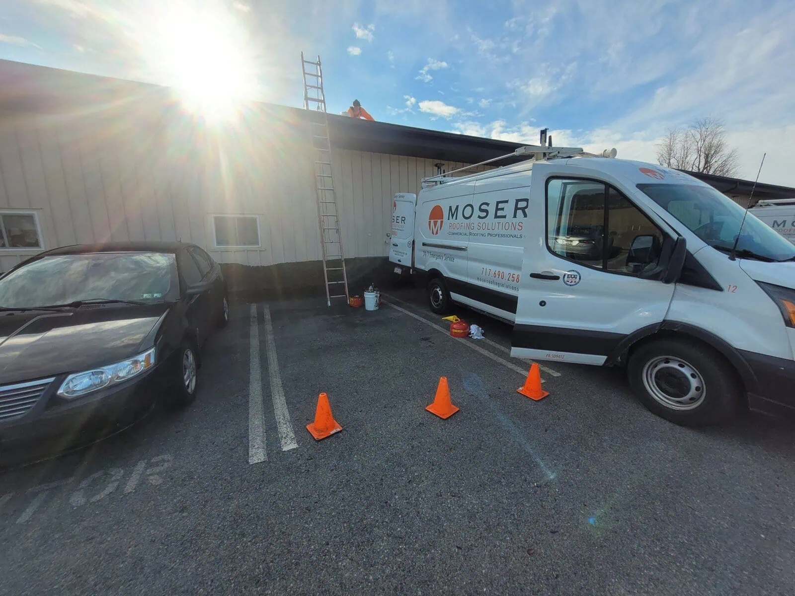 a white van parked in front of a building