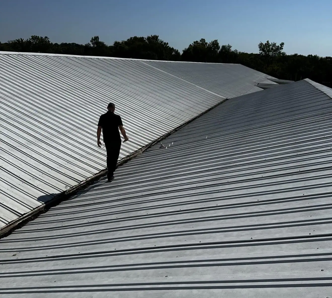 a man walking on a roof
