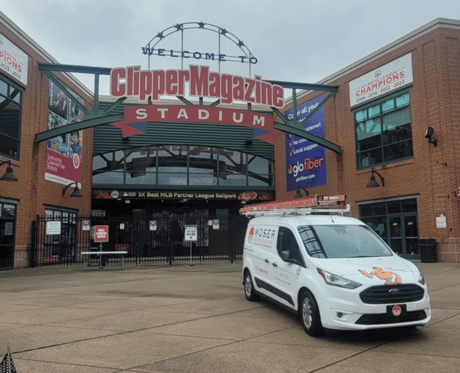 a white van parked outside of a building