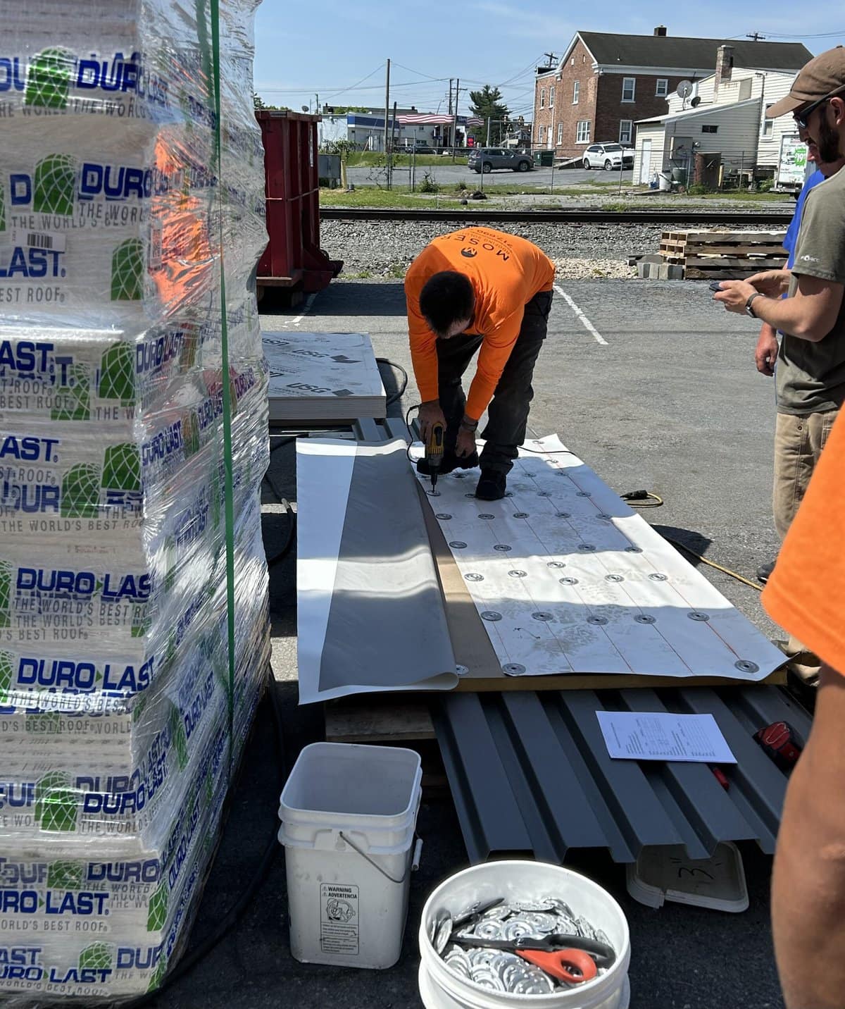 a group of men working on a roof