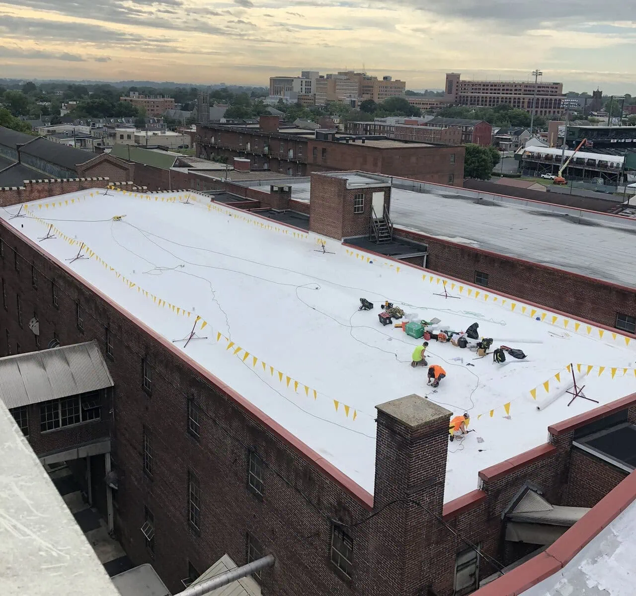 a roof of a building with flags on it